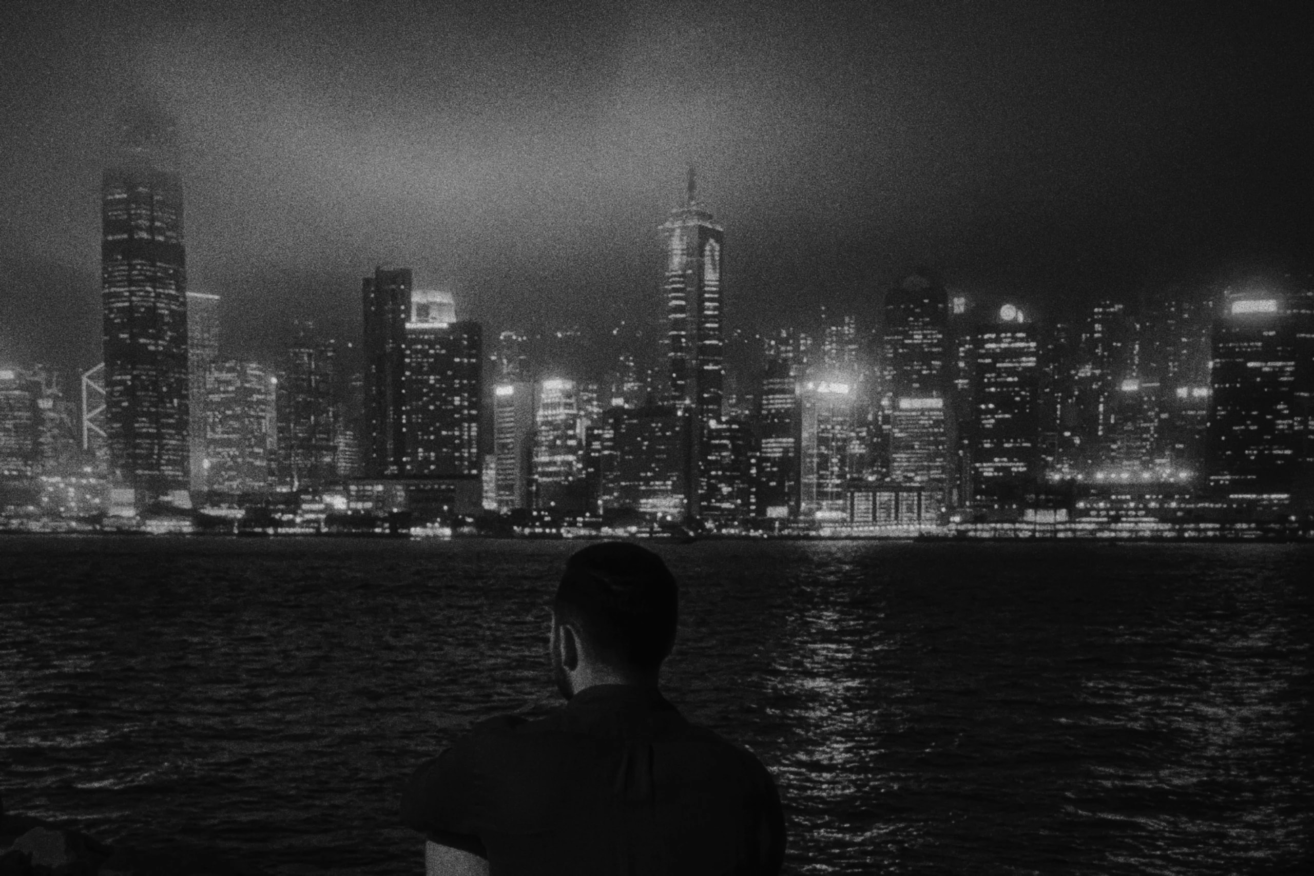 Rafael looking across the water at Hong Kong's skyline