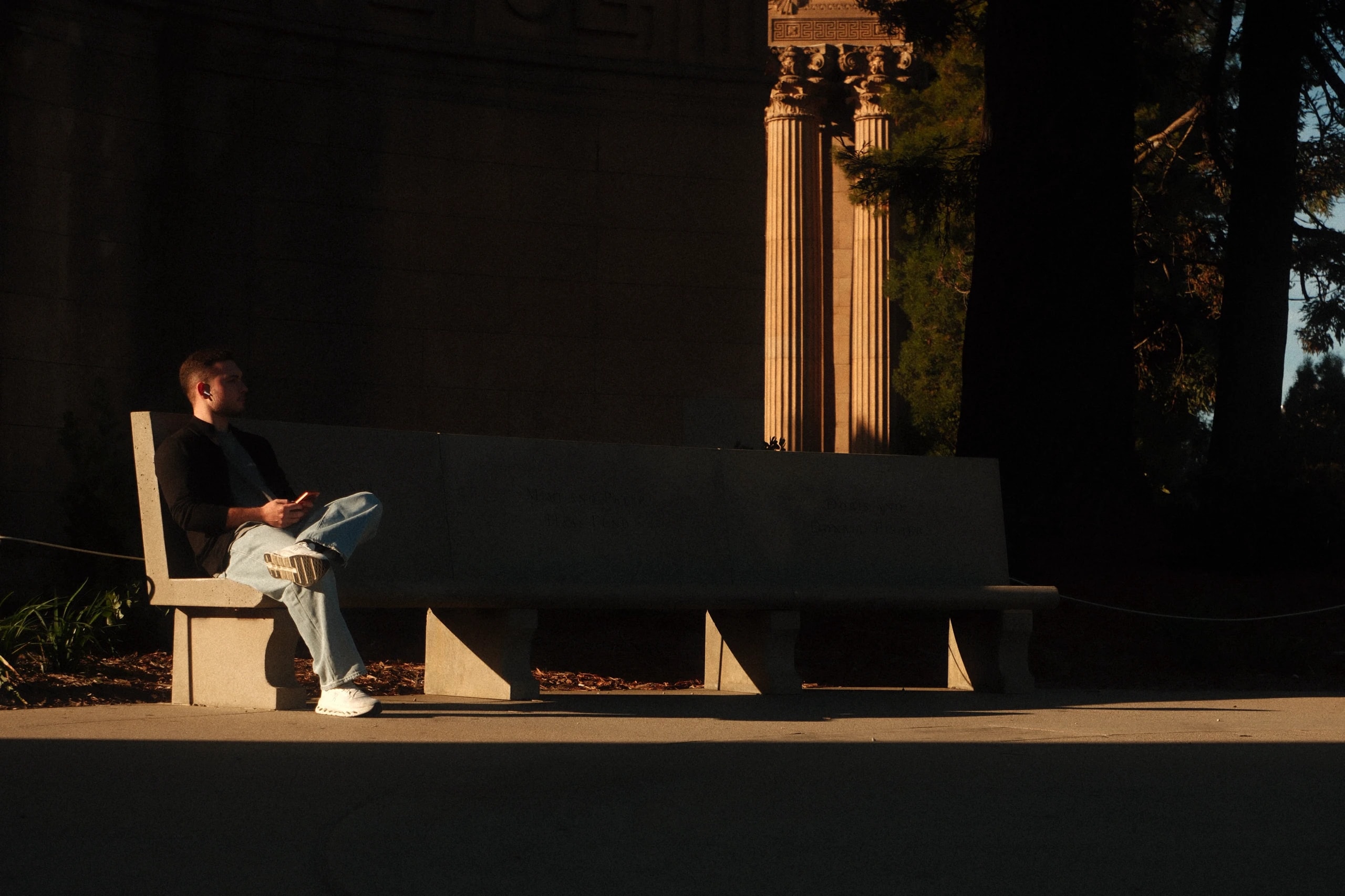 Rafael sitting at the Palace of Fine Arts in San Francisco